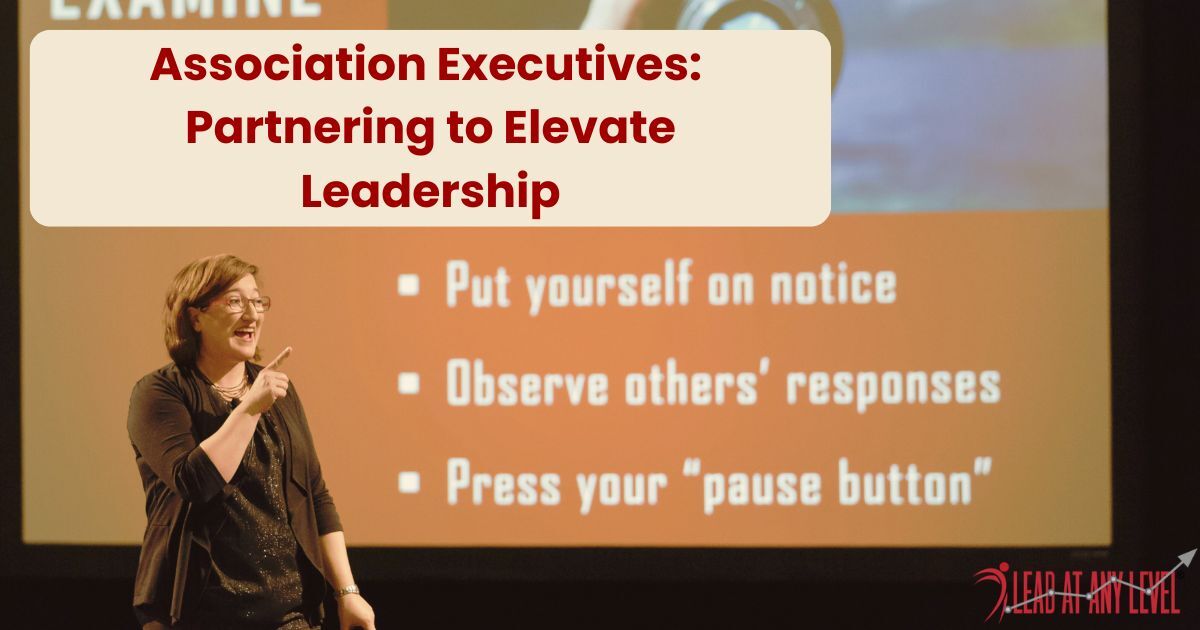 Amy Waninger address Association Executives from the keynote stage with her presentation slide displayed  in the background