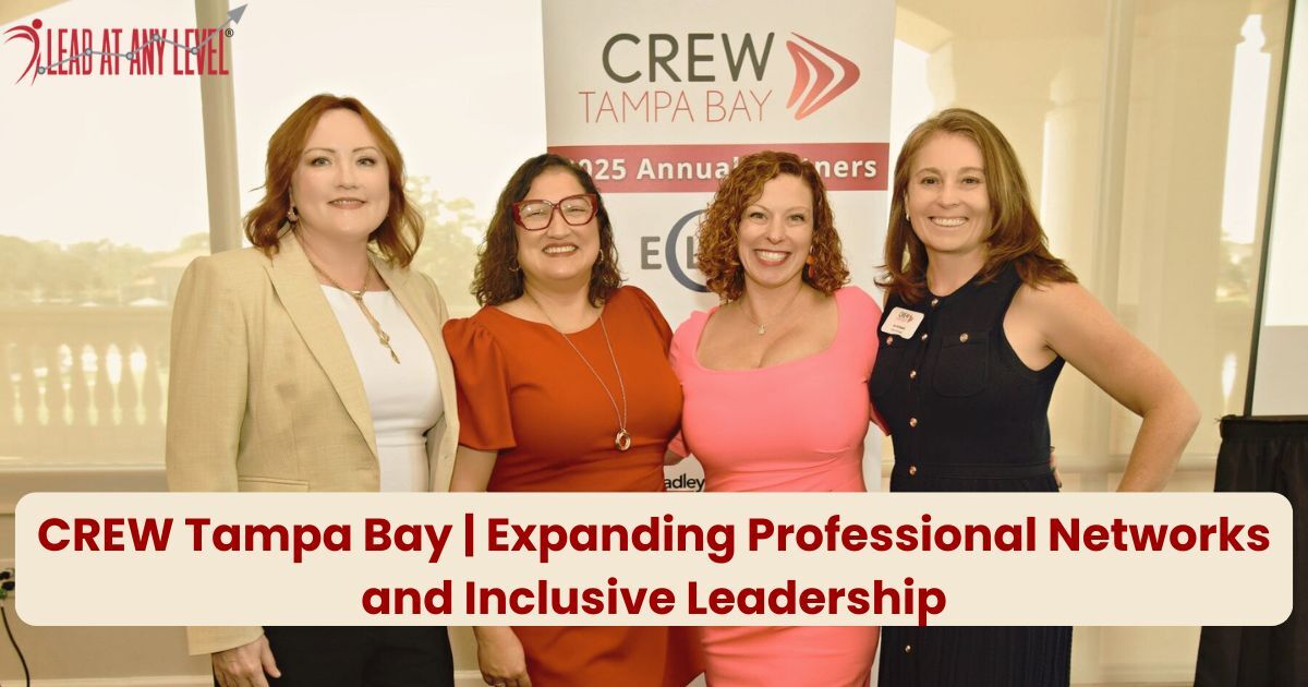 Amy Waninger poses with leaders of the CREW Tampa Bay Chapter in front of their logo