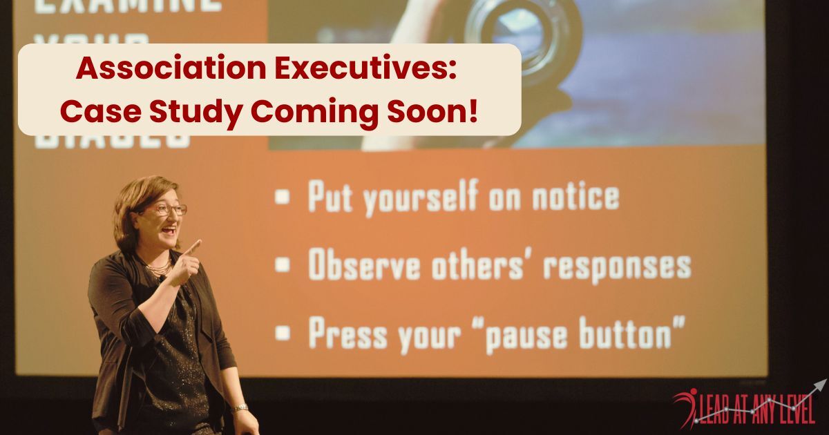 Amy Waninger address Association Executives from the keynote stage with her presentation slide displayed in the background