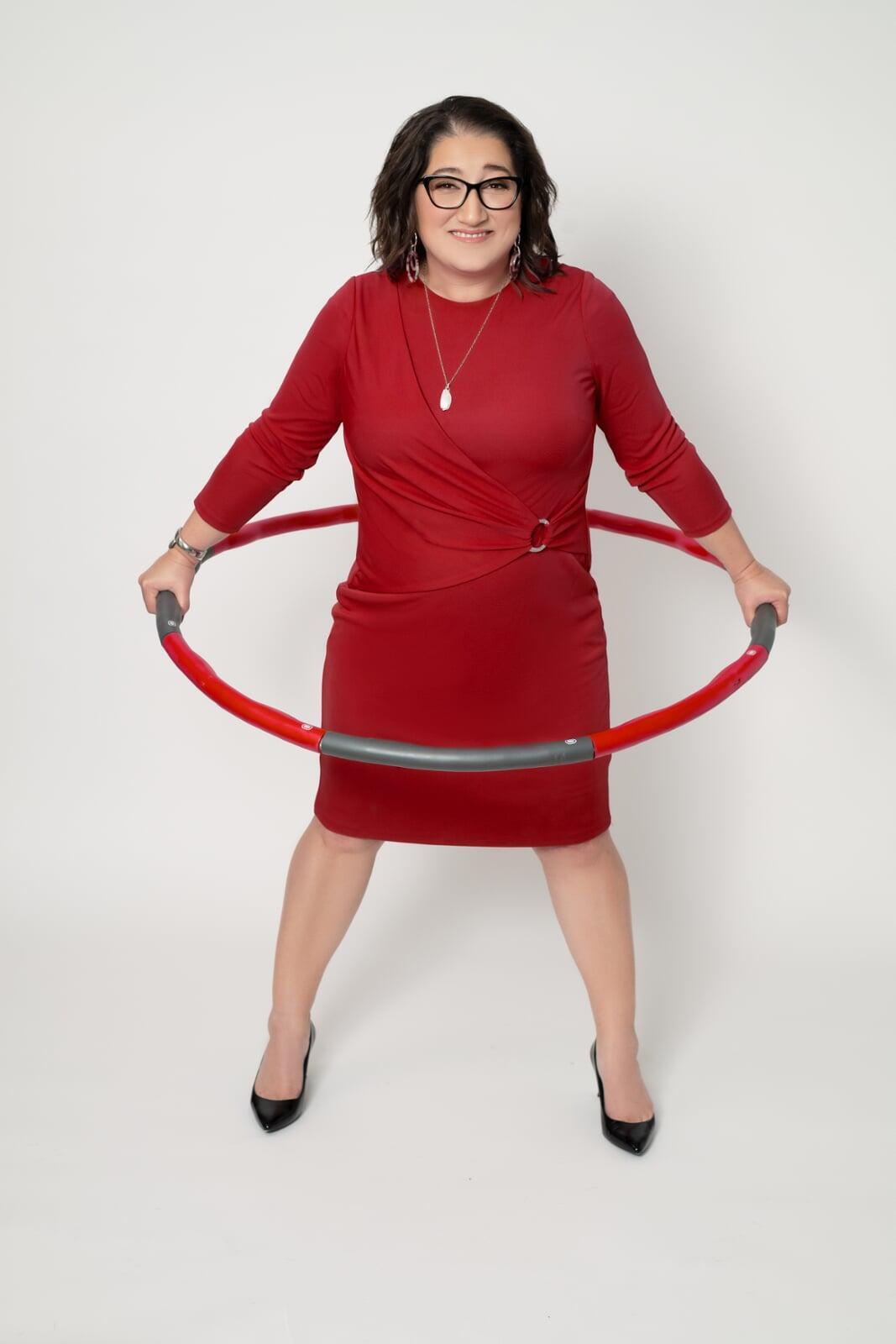 Amy C. Waninger stands inside a hula hoop